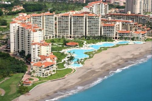 an aerial view of a resort and the beach at Paradise apartment, private beach condo Bay View Grand in Puerto Vallarta