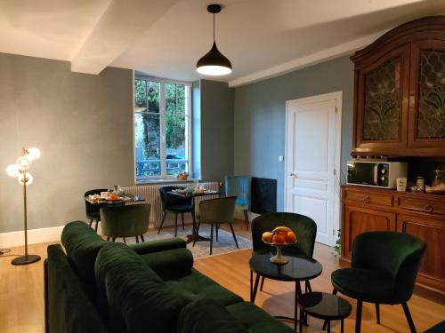 a living room with a couch and chairs and a table at Clos Terre-lune in Nuits-Saint-Georges