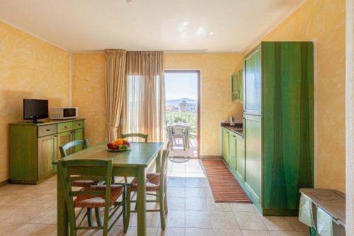 A kitchen or kitchenette at Appartamenti Le Maree