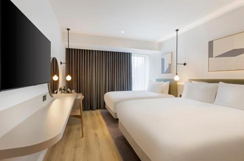 Voodi või voodid majutusasutuse Leonardo Hotel Manchester Piccadilly toas