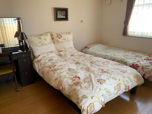 A bed or beds in a room at Tokai - House - Vacation STAY 11692