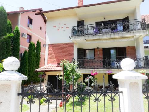 a house with a gate in front of it at Vila Nikola in Soko Banja