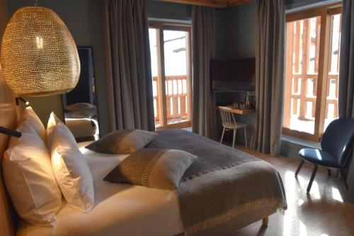 Uma área de estar em Hotel MONT-BLANC VAL D'ISERE