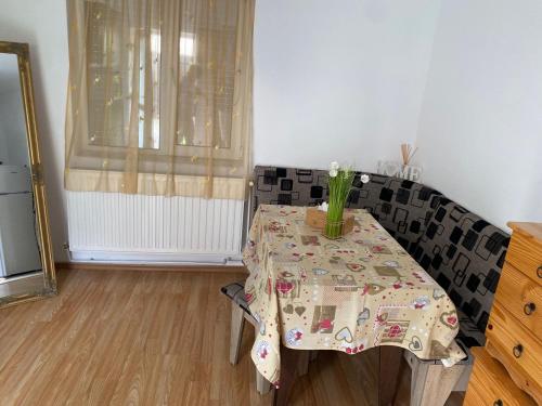 a table with a vase on it in a room at Private House Citadela Tg.Mures in Târgu-Mureş