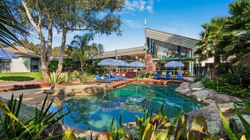 a swimming pool in the backyard of a house at Eden Oak Geelong in Geelong