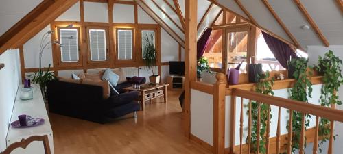 a living room with a couch and some plants at Haus Winkelchen in Cochem