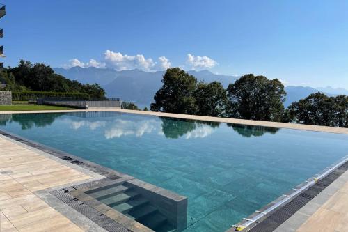 The swimming pool at or close to Les Terrasses de Lavaux 1 - Appartement de luxe avec vue panoramique et piscine