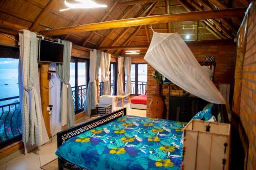 Cama ou camas em um quarto em Hakuna Matata Lodge