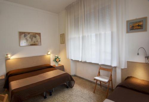 A bed or beds in a room at Hotel La Torre