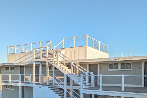 a building with stairs on the side of it at Falmouth Tides in Falmouth