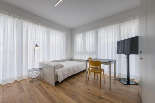 Llit o llits en una habitació de Modern Studios Mendrisio