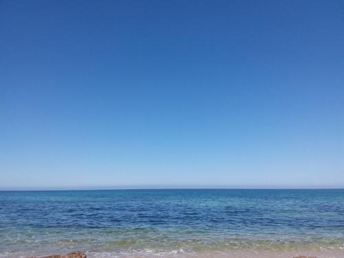 uitzicht op de oceaan vanaf het strand bij Casa Vacanza Portu Maga (Marina di Arbus-Sardegna) in Portu Maga