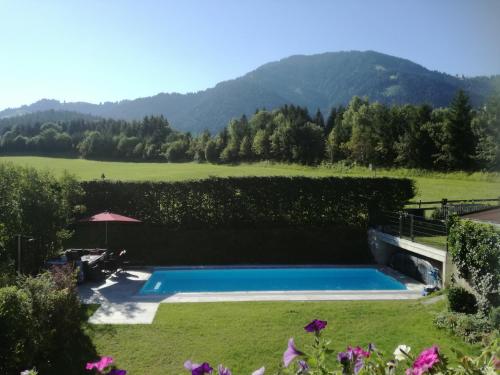 a swimming pool in the middle of a yard at Appartement Unterbering in Söll