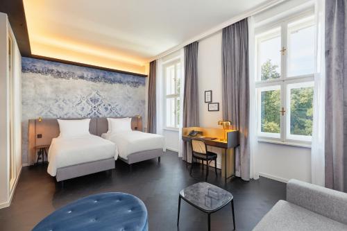 Voodi või voodid majutusasutuse HYPERION Hotel Salzburg toas