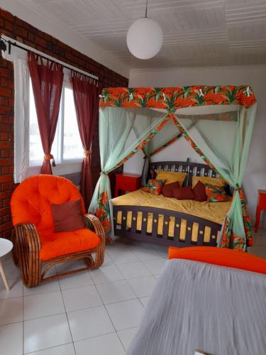 Tempat tidur dalam kamar di Avamada Lodge