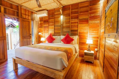 Una cama o camas en una habitación de Nauna Villa Ubud