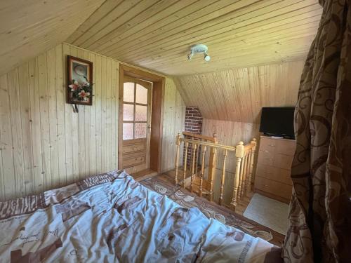 Säng eller sängar i ett rum på Mini Cottage