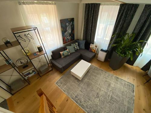 A seating area at Stylish two-floor apartment in a heart of Basel