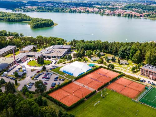 an aerial view of a park next to a body of water at Hotel Mrągowo Resort&Spa in Mrągowo