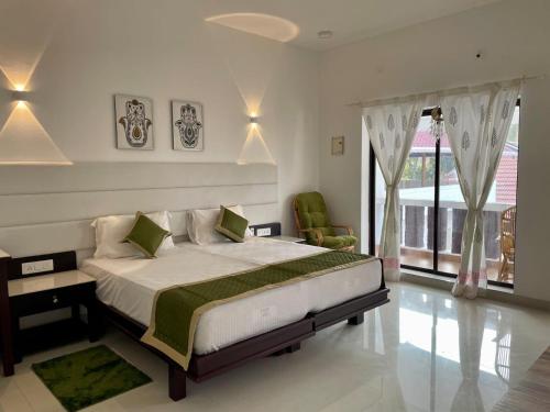 Cama ou camas em um quarto em Veda5 Ayurveda Living Village