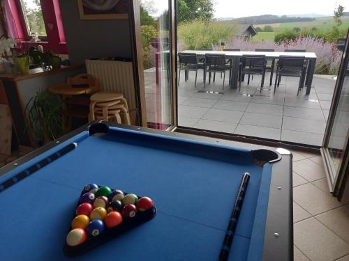 a pool table with balls on top of it at Bonheur à la campagne in Bastogne