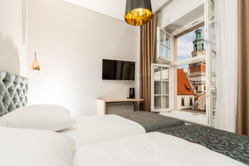 Katil atau katil-katil dalam bilik di Sleep in Hostel & Apartments Stary Rynek