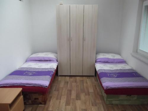 Una cama o camas en una habitación de Penzion Apartmány Zlín