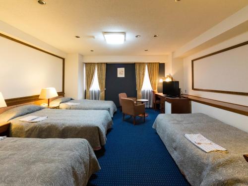 Gulta vai gultas numurā naktsmītnē Hotel Matsunoka Ichinoseki