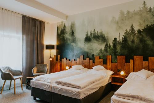 Una cama o camas en una habitación de Wellness Hotel Liberecká Výšina