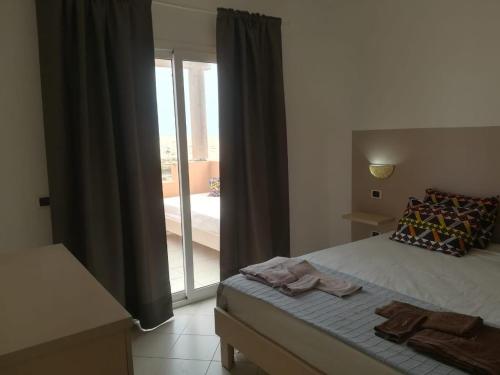 Tempat tidur dalam kamar di Residence Por Do Sol, Praia Cabral, Boa Vista, Cape Verde, FREE WI-FI