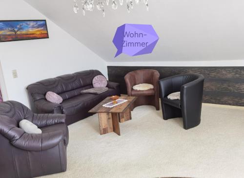 a living room with couches and chairs and a table at Ländliche Idylle in Hochfranken in Regnitzlosau