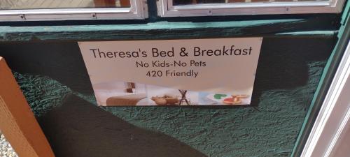 a sign that says there is a bed and breakfast at Quiet upstairs studio close to town 420 friendly in Trinidad