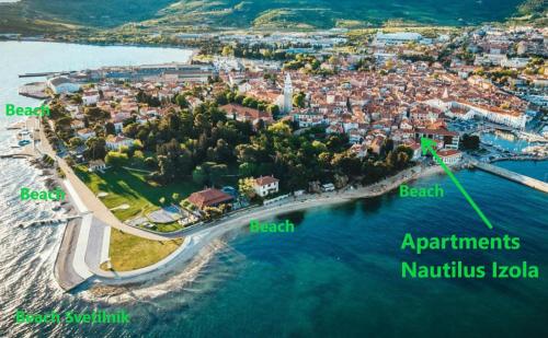 una vista aerea di una piccola isola in acqua di Apartments Nautilus, nearby beach Svetilnik a Izola