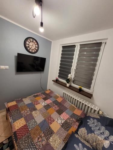 Ένα ή περισσότερα κρεβάτια σε δωμάτιο στο Apartament Leon