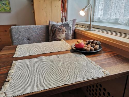 a table with an owl sitting on top of it at Molignon - Ortisei - Val Gardena in Ortisei