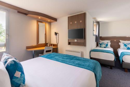 Tempat tidur dalam kamar di Sure Hotel by Best Western Lille Tourcoing Ex Hotel Garden