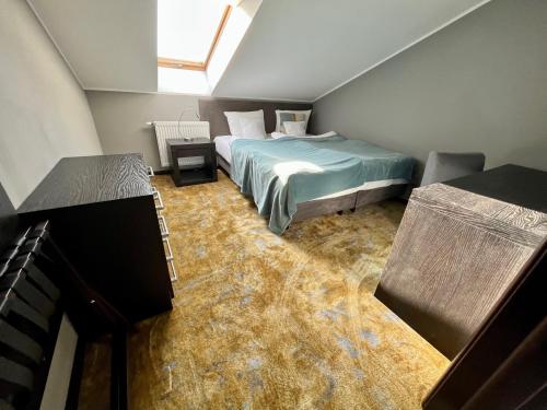 a bedroom with a bed and a floor covered in water at Malta Premium in Poznań