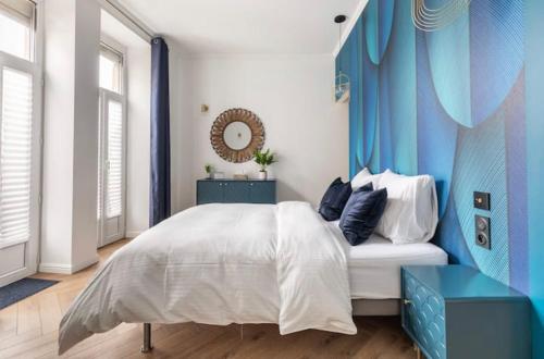 Una cama o camas en una habitación de Appart Deluxe Privé Strasbourg Centre avec Parking gratuit