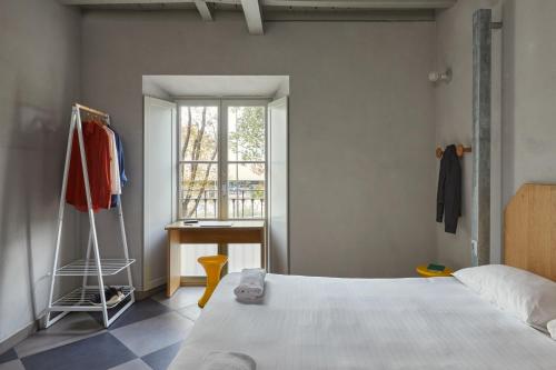 Una cama o camas en una habitación de Combo Milano