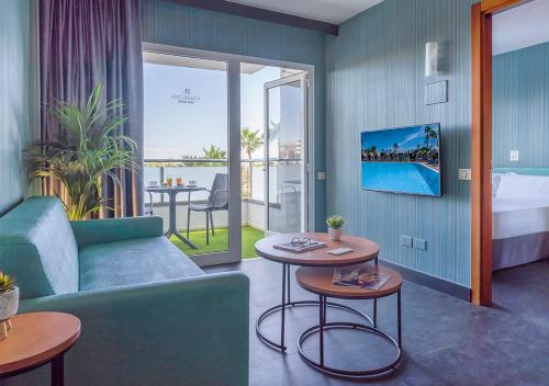 A television and/or entertainment centre at Axel Beach Maspalomas - Adults Only