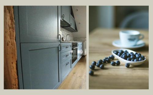 a kitchen with a counter with a bowl of fruit on a table at Nora Berry in Nida