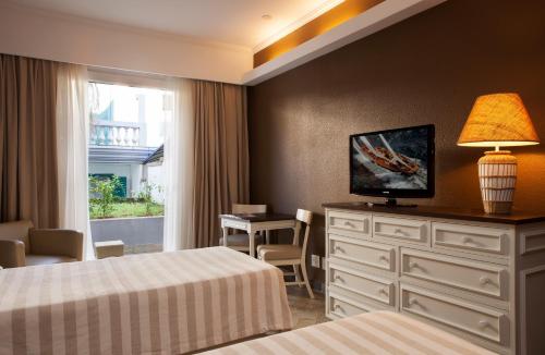 Giường trong phòng chung tại Casa Grande Hotel Resort & Spa