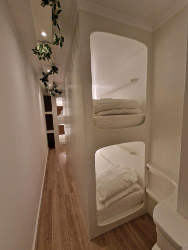 a room with a closet with white towels at Hostel The Golden Stork in The Hague