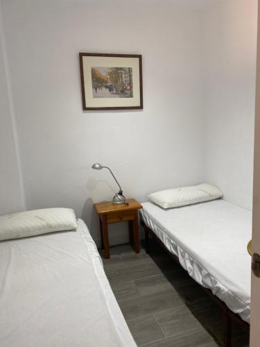 Cama ou camas em um quarto em Apartamento alto standing con piscina privada, aire acondicionado y wifi