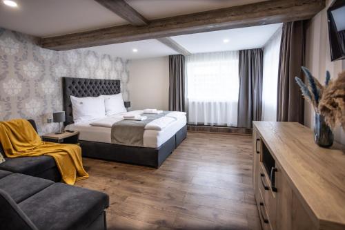 Cama ou camas em um quarto em Hotel Demanova Apartments - Dependance