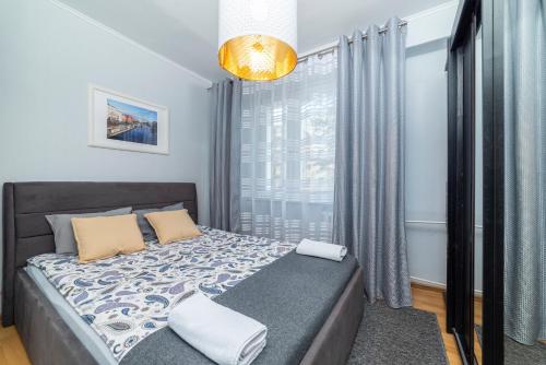 Кровать или кровати в номере Apartament Gersona 4