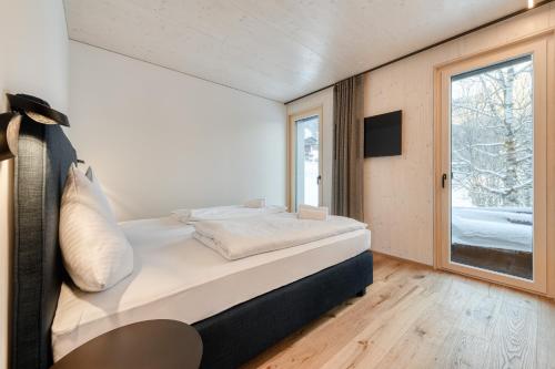 En eller flere senge i et værelse på Appartement Zentral mit Panoramasauna by A-Appartments