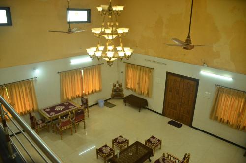 an overhead view of a living room with a chandelier at Airspace villa in Igatpuri