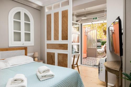 A bed or beds in a room at Well Apartments by Skyloft Corfu