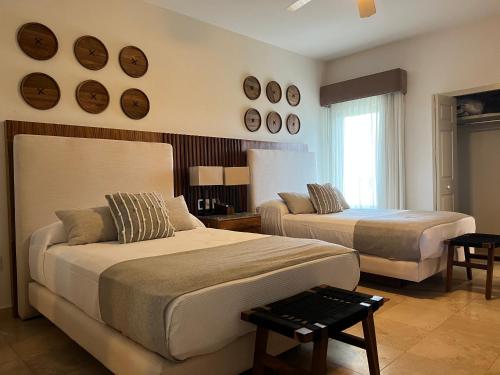 Ένα ή περισσότερα κρεβάτια σε δωμάτιο στο Beachfront 2 bedroom Condo in Playa Royale Resort, Nuevo Vallarta